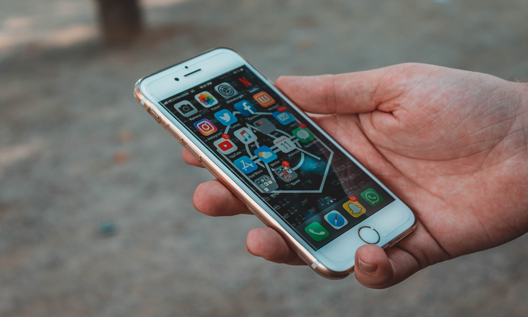 Person holding white iPhone